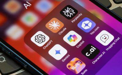 close up shot of a phone featuring a folder full of notable AI apps