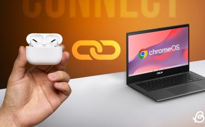 hand holding AirPods case next to a Chromebook placed on a white desk with a yellow black background