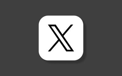 X app logo in front of a grey background