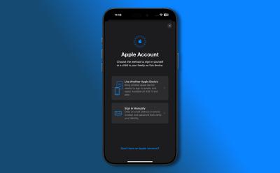 A close-up of an iPhone screen displaying the Apple Account sign-in page with two options: "Use Another Apple Device" and "Sign in Manually", along with a "Don't have an Apple Account?" link