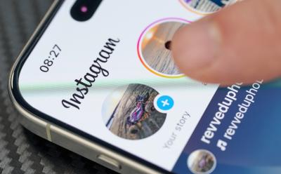 iPhone with Instagram app open showing stories in closeup view