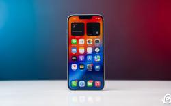 iPhone 16e image with a red background