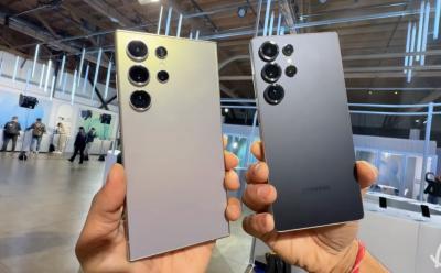 hands holding the Samsung Galaxy S24 Ultra and Galaxy S25 Ultra showcasing rear panels of both devices