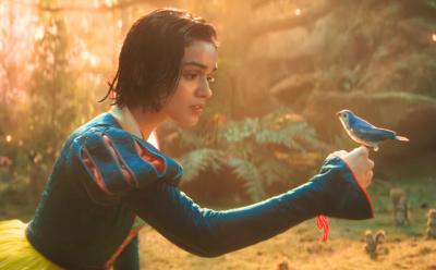 A snippet from Disney's Snow White where a bird is sitting on her finger