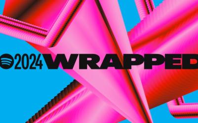 Spotify Wrapped 2024 text in front of a blue and pink background