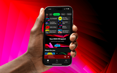 hand holding phone with Spotify Wrapped 2024 open on the screen